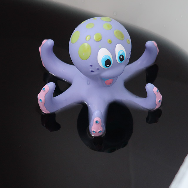 A bath turned black using a bath bomb from Hexbomb