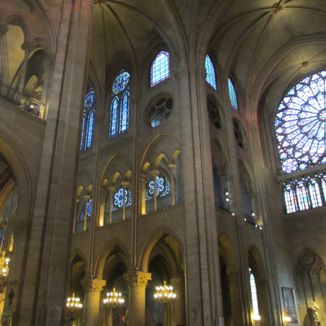 The arched ceiling and tiered interior of Notre-Dame
