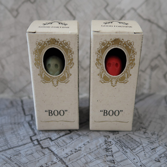 Two small ghosts in boxes