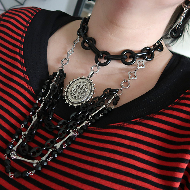 A necklace and earrings using recycled antique chain, likely jet