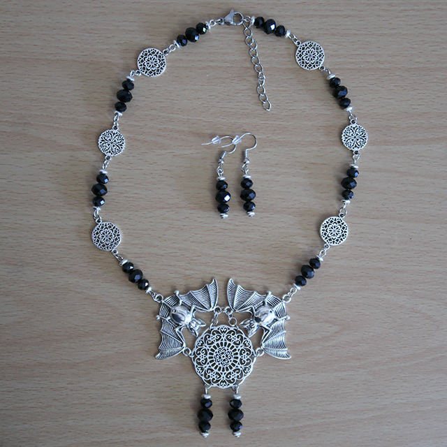 Floral Lace Bats necklace and earrings (overhead view)